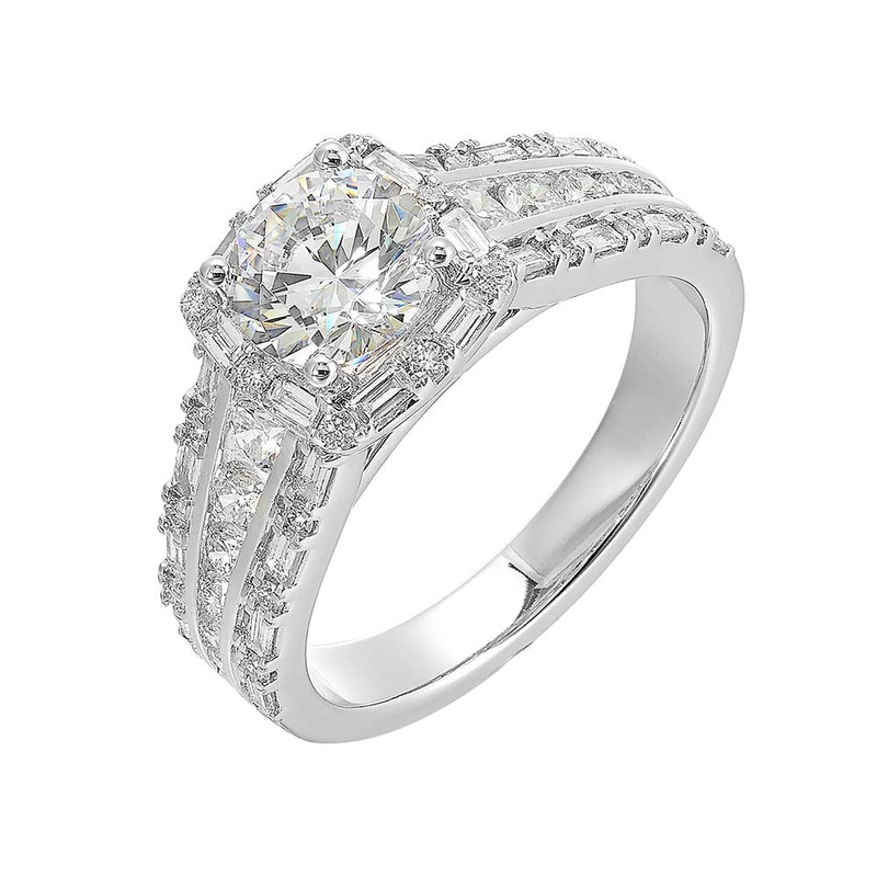 Round Solitare cushion halo ring features baguette and round diamonds. The band tappers towards the bottom,  adorned with three row look is sure to impress her.