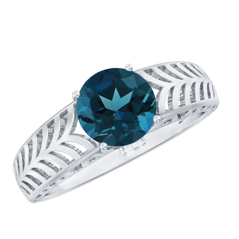 Round London Blue Topaz Solitaire Ring in Cut Out Work